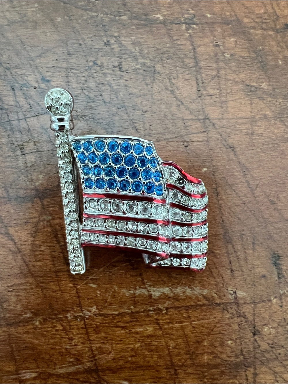 Swarovski Crystal American Flag Brooch featuring a waving silver-tone design